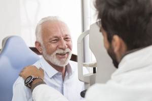 Senior Patient consulting With Optician In Office